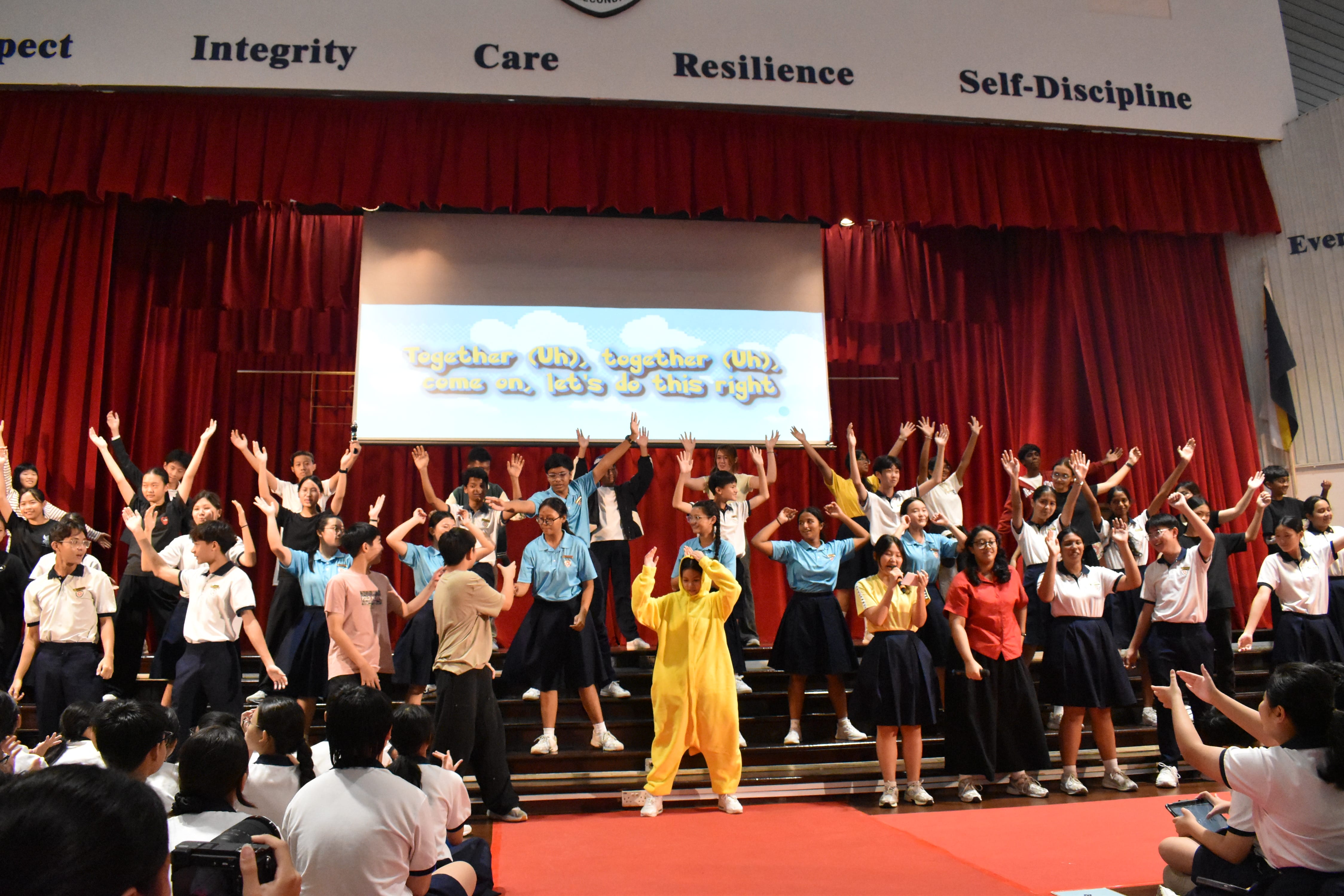 Students breaking out into final pose for the finale performance